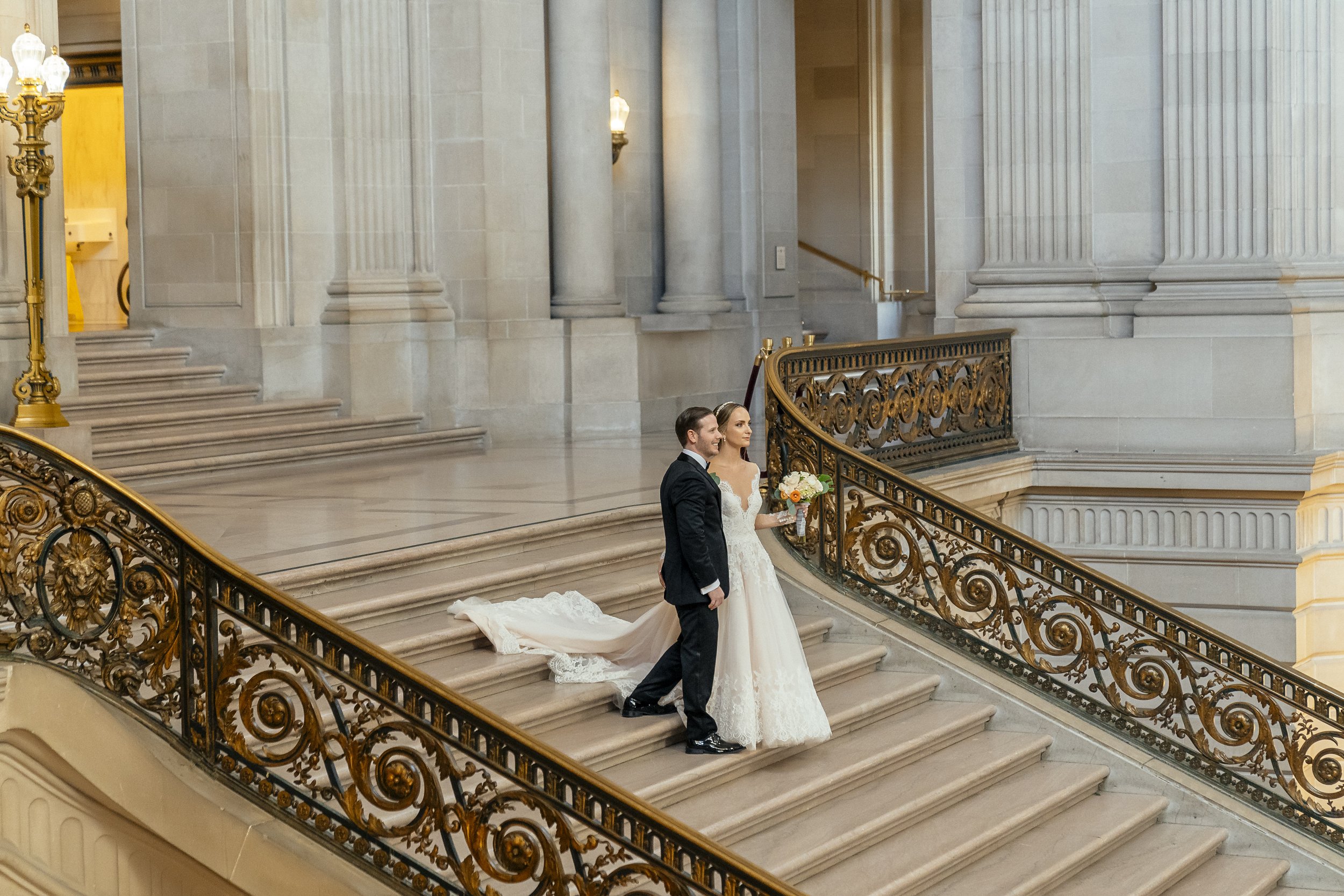 SF City Hall Elopement Photography of a couple on the Grand Staircase