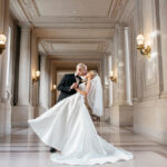 Photography of a groom Dipping the bride for a kiss in San Francisco City Hall