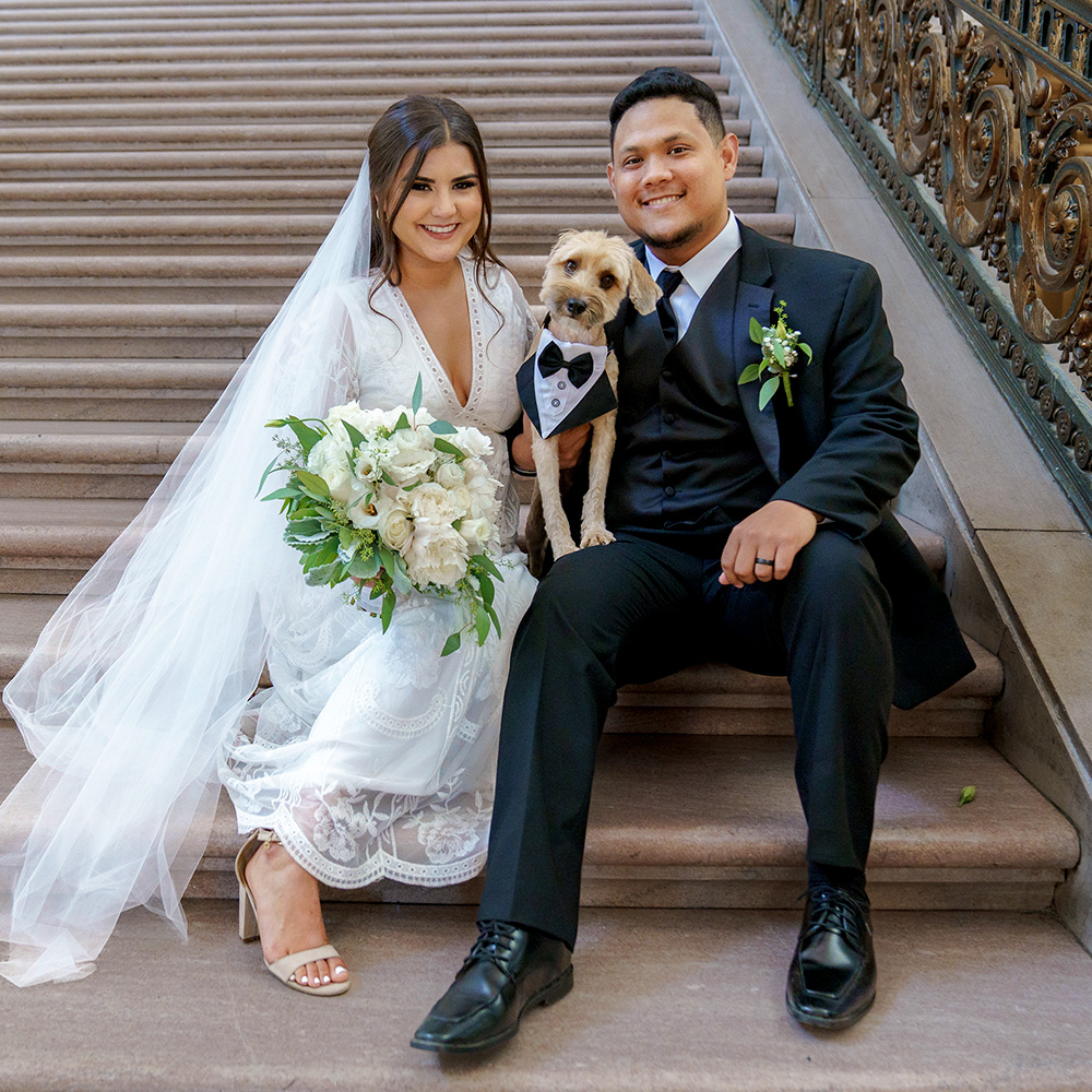 Photography of a couple getting married at SF City hall brought their little dog to the Wedding Ceremony.