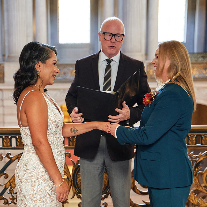 Female couple adding a celtic hand fastening ceremony to their SF City Hall Wedding