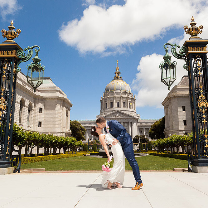 Couple kissing in front of city hall