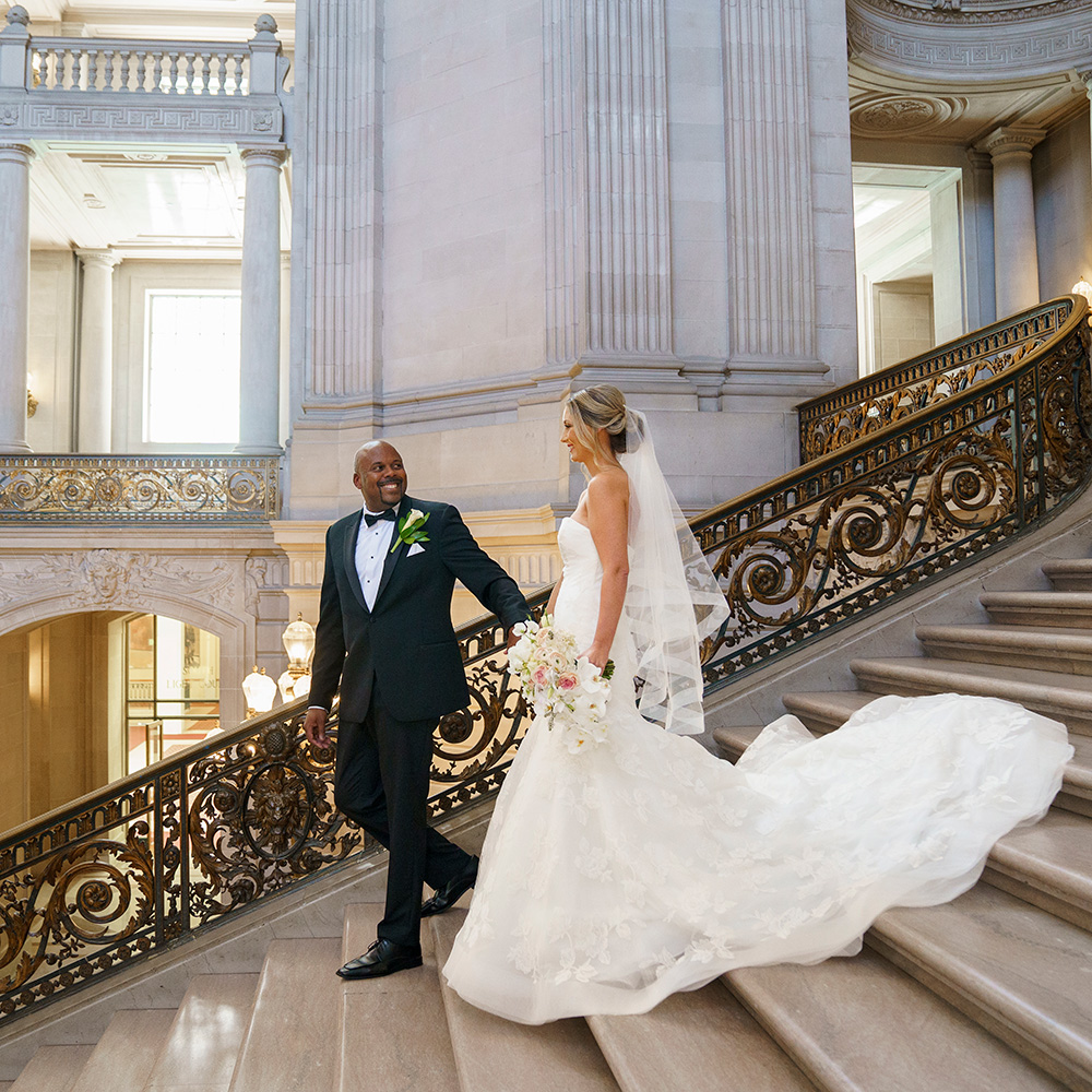 Photography of a Biracial couple walking down the grand staircase at San Francisco City Hall