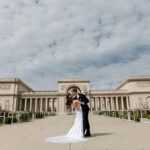 Outdoor photography near San Francisco City Hall Couple kissing in front of Legion of Honor