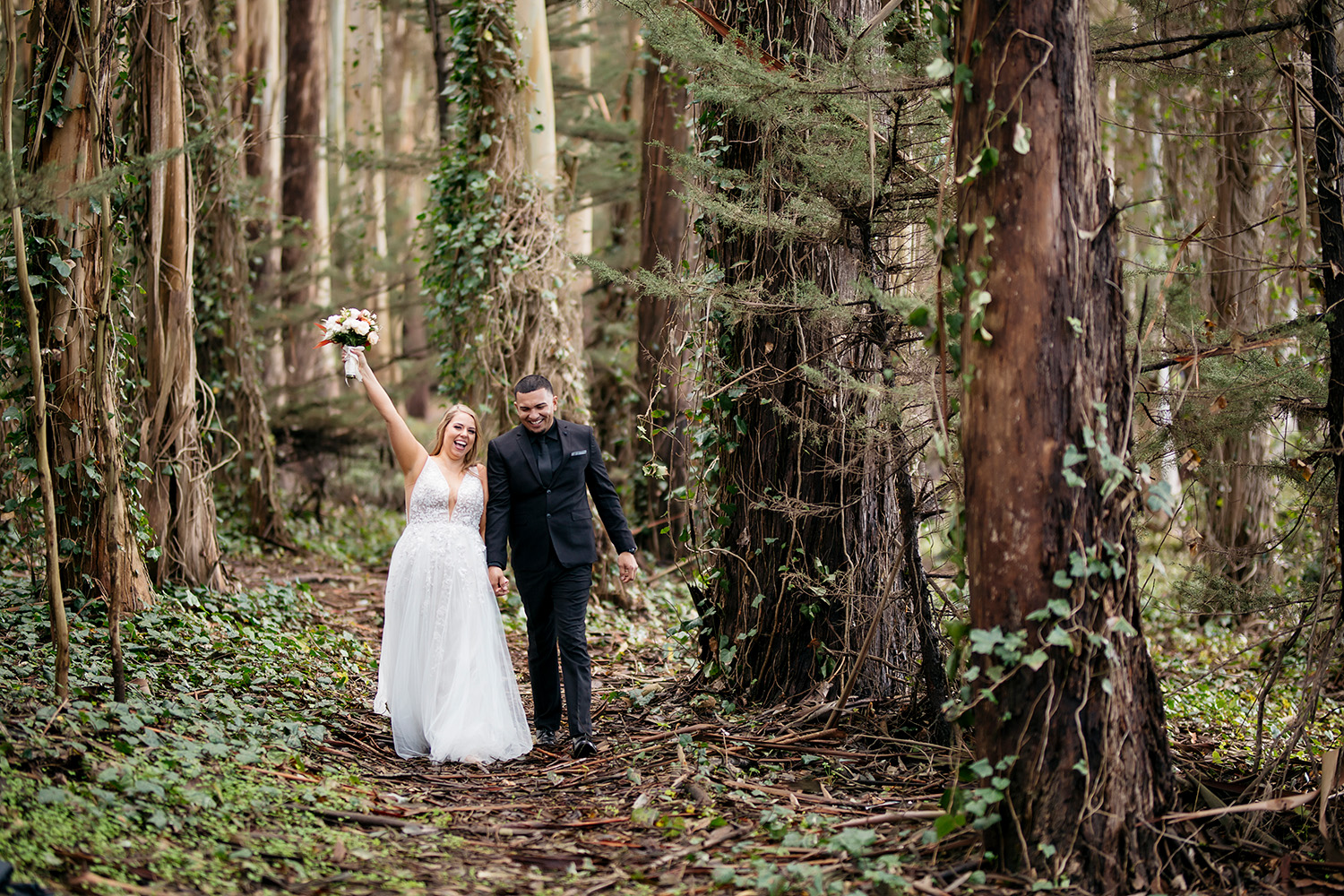 Wedding Photography of couple walking down a path in the redwood forest