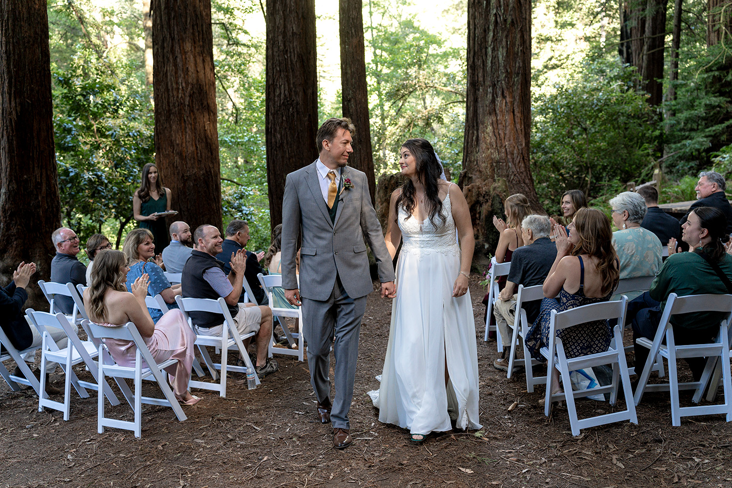 Wedding Photography of couple walking down the aisle in the redwood forest