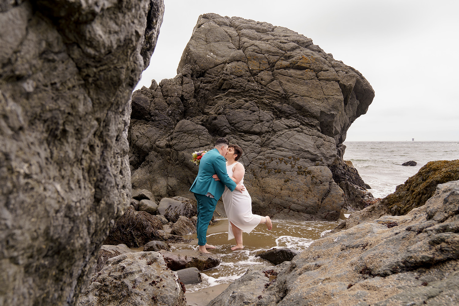 Same sex couple elopement portraits on Marshall Beach in San Francisco
