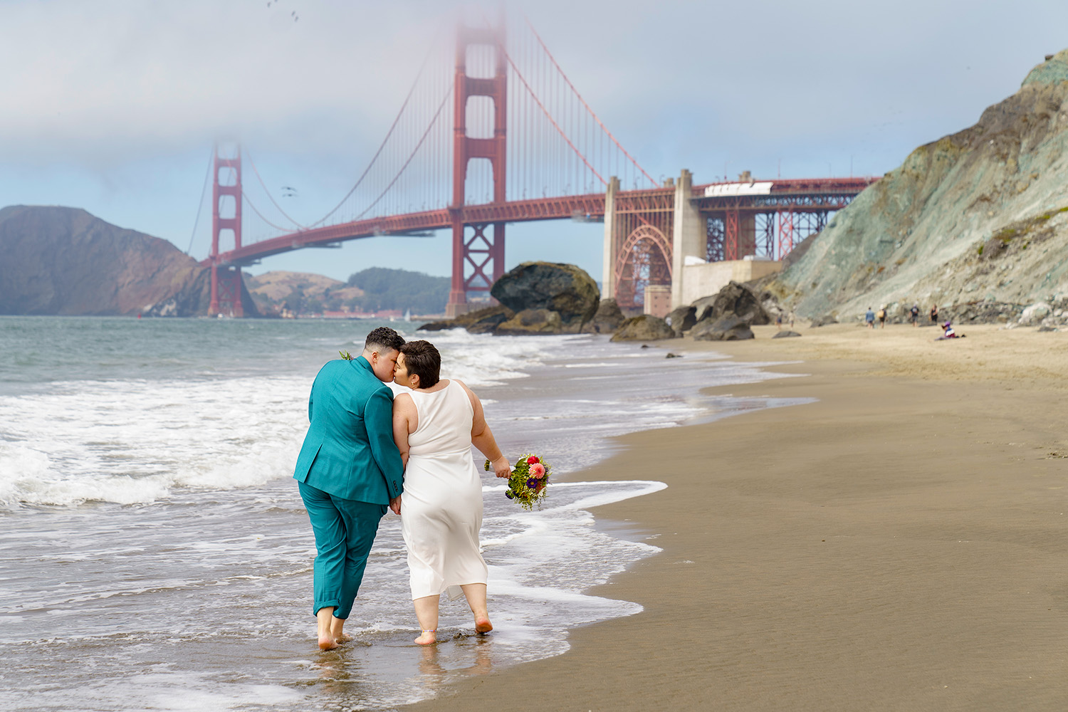 Same sex couple elopement portraits on Marshall Beach in San Francisco
